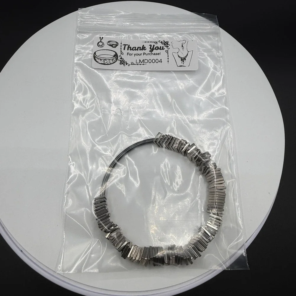 N/A sculptural silver